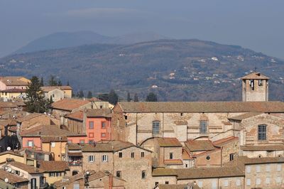 High angle view of townscape and mountains against sky