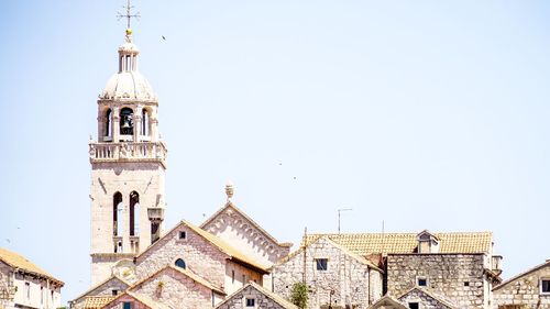 Low angle view of bell tower against clear sky