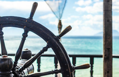 The steering wheel of the ship on the background of the sea