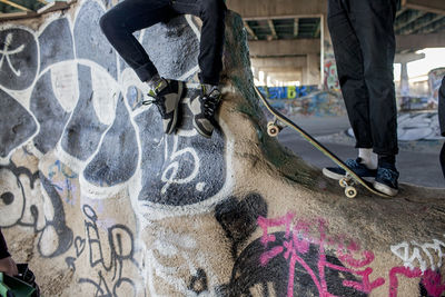 Two young men at a skateboard park.