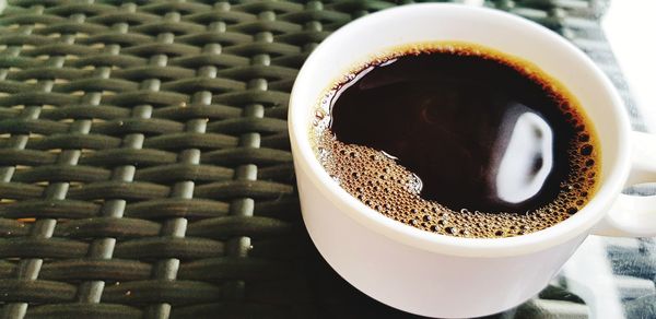 Close-up of coffee cup on table