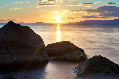 Scenic view of sea against sky during sunset