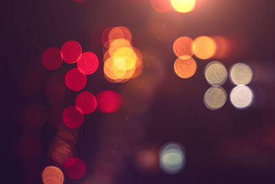 Defocused image of illuminated lights at night