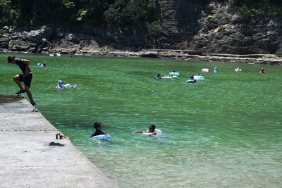 People swimming in water