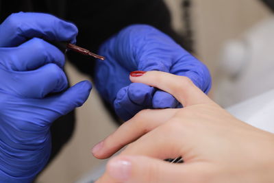 Midsection of dentist examining patient