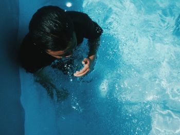 Woman swimming in pool