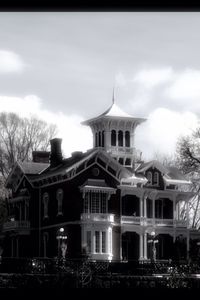 Low angle view of building against cloudy sky