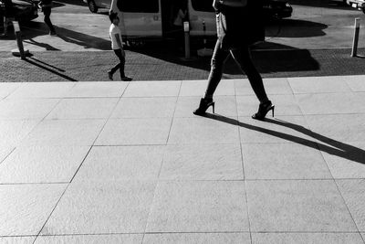 Shadow of people on street