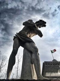 Low angle view of statue against sky