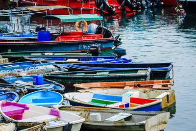 High angle view of boats moored at harbor