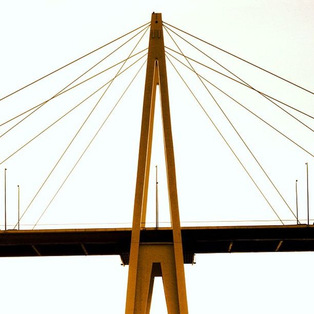 connection, low angle view, clear sky, cable, engineering, power line, bridge - man made structure, suspension bridge, electricity pylon, power supply, transportation, built structure, electricity, bridge, cable-stayed bridge, copy space, outdoors, no people, day, steel cable