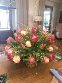 Flower vase on table at home