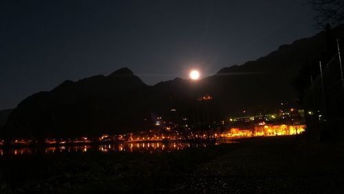 Illuminated mountain against sky at night