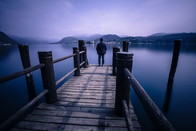 People walking on pier