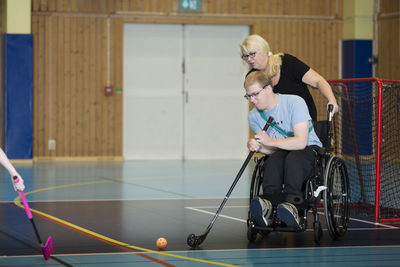 Disabled people playing in gym