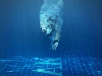 Low angle view of woman jumping in water