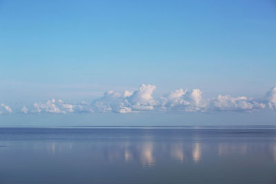 Calm ocean sound with low clouds on a clear morning