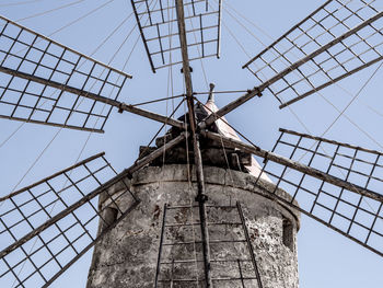 A particular close shot of an old windmill located in the salt pans of  trapani