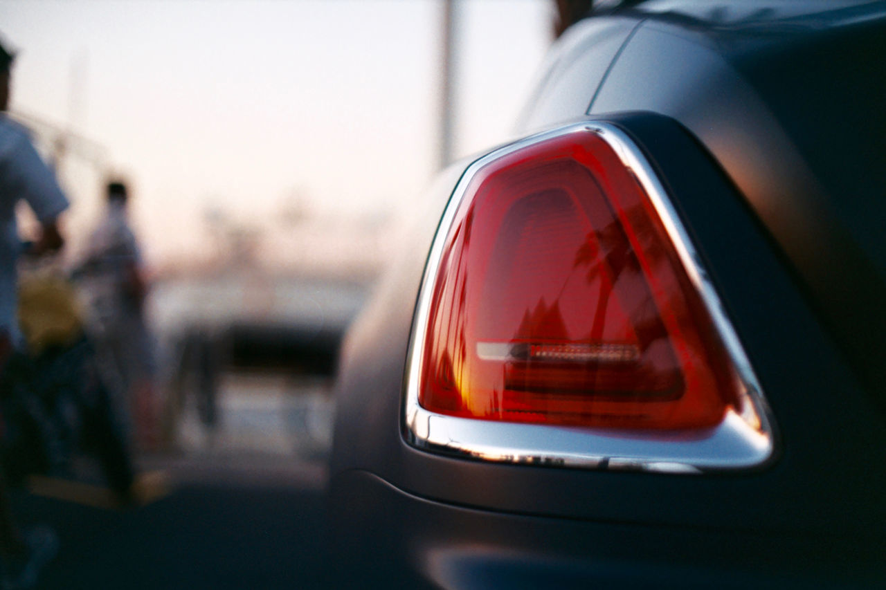 REFLECTION OF CAR ON SIDE-VIEW MIRROR