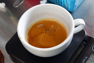 High angle view of coffee cup on table