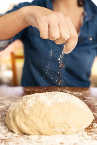 Midsection of person preparing food