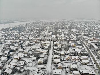 High angle view of buildings in city against sky