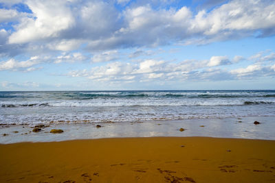 Scenic view of beach against sky