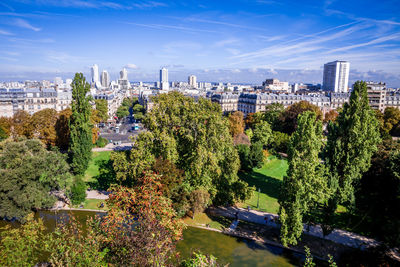 High angle view of trees and buildings against sky