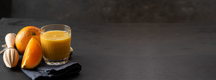 Orange juice in glass on table