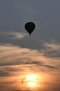 Low angle view of hot air balloon against sky during sunset