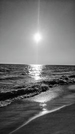 Scenic view of sea against clear sky at sunset