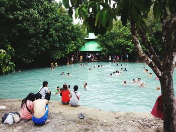 People relaxing on beach