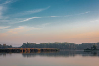 Scenic view of lake against sky during sunset