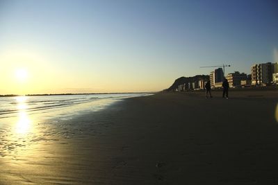 Scenic view of sea against clear sky during sunset