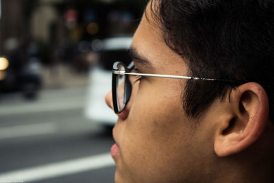 Close-up of young man wearing eyeglasses