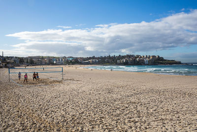 People playing volleyball on beach