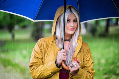 Portrait of a smiling young woman in park