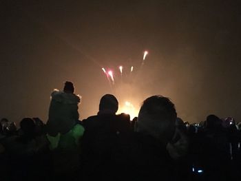 Silhouette people at music concert