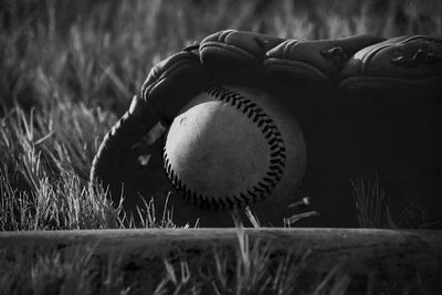 Close-up of old ball on field