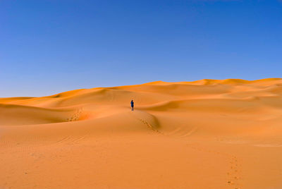 Scenic view of desert against clear sky