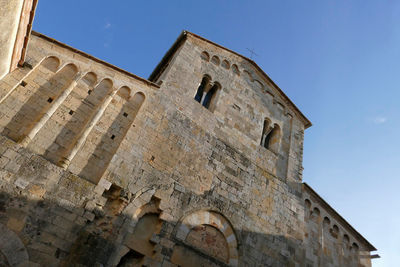 Low angle view of historical building against blue sky