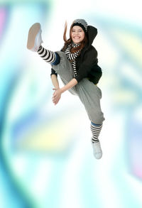 Portrait of teenage girl jumping