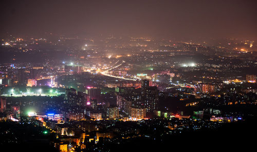 Arial view of illuminated city at night