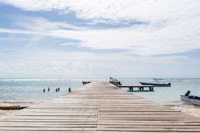 Pier over sea against sky