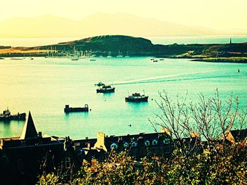 Scenic view of sea with mountain range in background