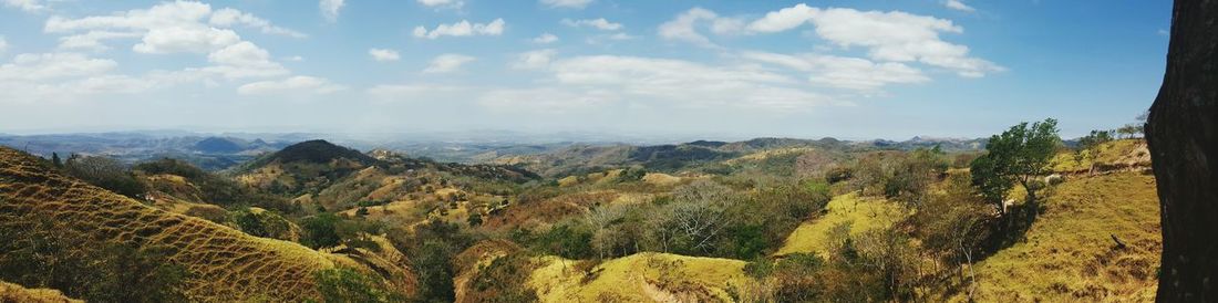 Scenic view of landscape against cloudy sky