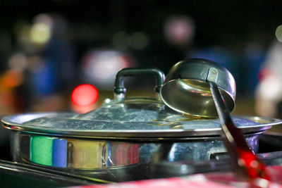 Close-up of ladle on cooking pot in kitchen