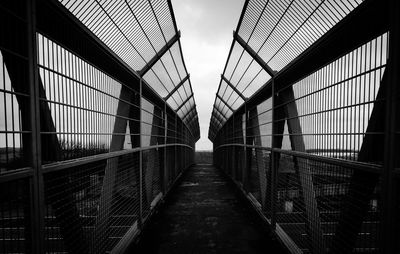 Footbridge against sky