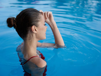 High angle view of woman swimming in pool