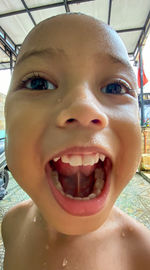 Close-up portrait of smiling boy